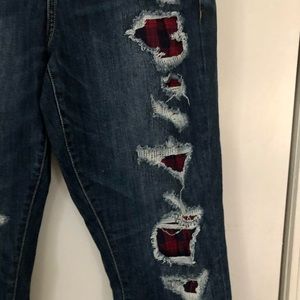 Torrid premium boyfriend jeans with navy blue/red plaid fabric under the rips